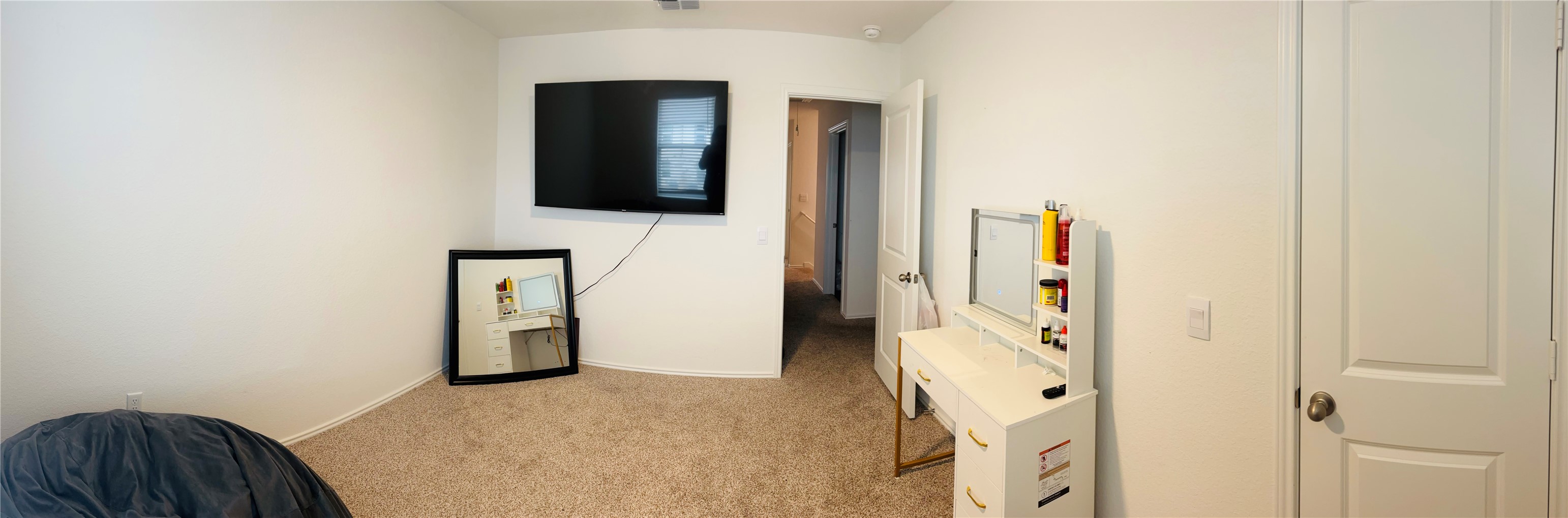 14817 Perlino Way, Unit A Manor, TX 78653 - Photo 16 of 40 a view of a livingroom with an empty space and a hallway