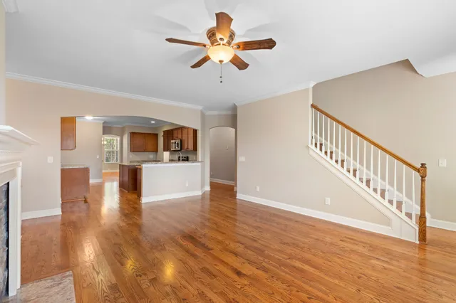 a view of an entryway with wooden floor