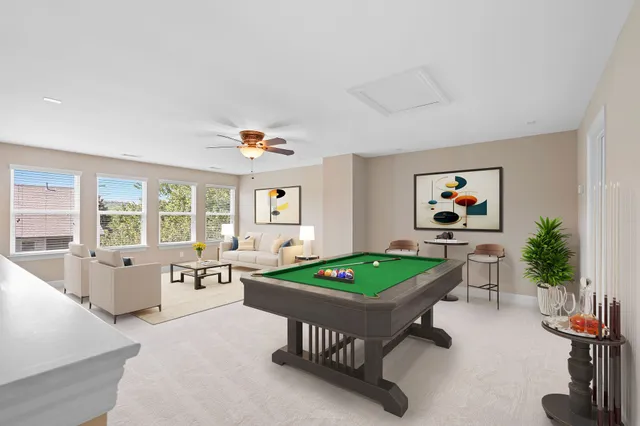 a living room with furniture and a table