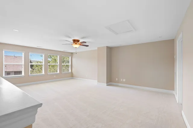 an empty room with windows and entrance