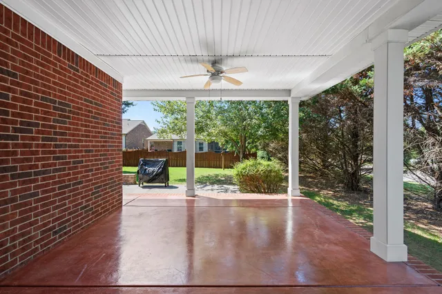 a view of a patio with a garden
