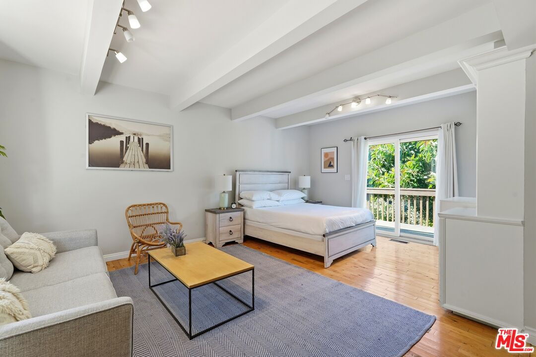2955 Corral Canyon Road Malibu, CA 90265 - Photo 9 of 21 a bedroom with furniture and a window