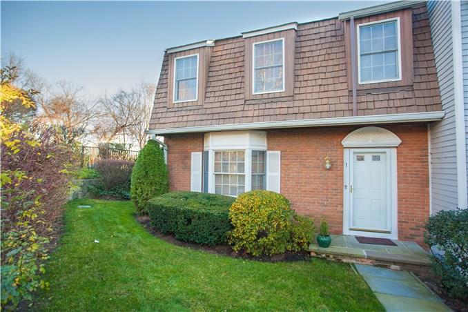 78 River Road, Unit 1 Greenwich, CT 06807 - Photo 1 of 1 a view of front of a house with a yard