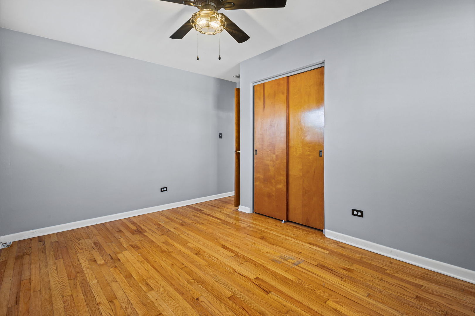 5901 108th Place Chicago Ridge, IL 60415 - Photo 12 of 15 a view of empty room with wooden floor and fan