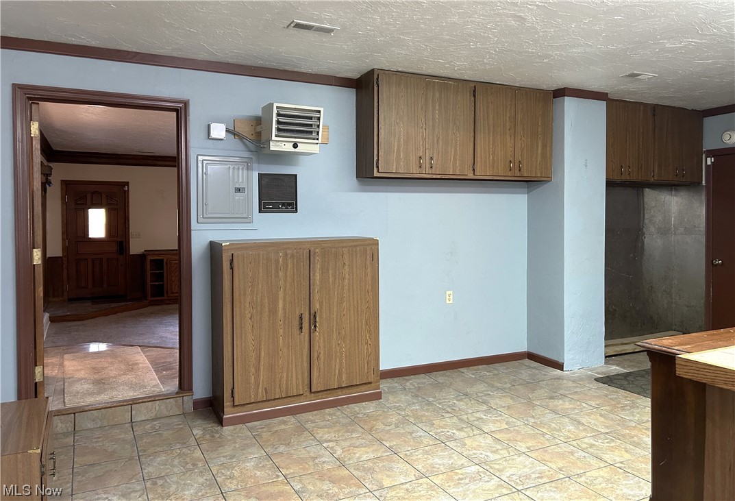 7855 Mulberry Road Chesterland, OH 44026 - Photo 22 of 46 Laundry Room with tile floors and crown molding.