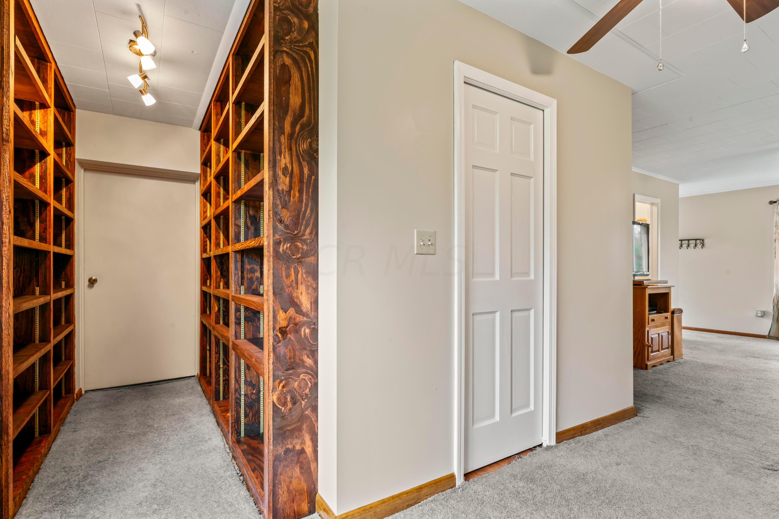 1544 Demorest Road Columbus, OH 43228 - Photo 6 of 18 Bookcases lead to the Master Bedroom, Huge Walk-In Closet & Bedroom with Sitting Area.