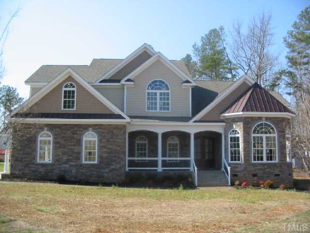 8212 La Matisse Road Raleigh, NC 27615 - Photo 1 of 5 a front view of a house with a yard
