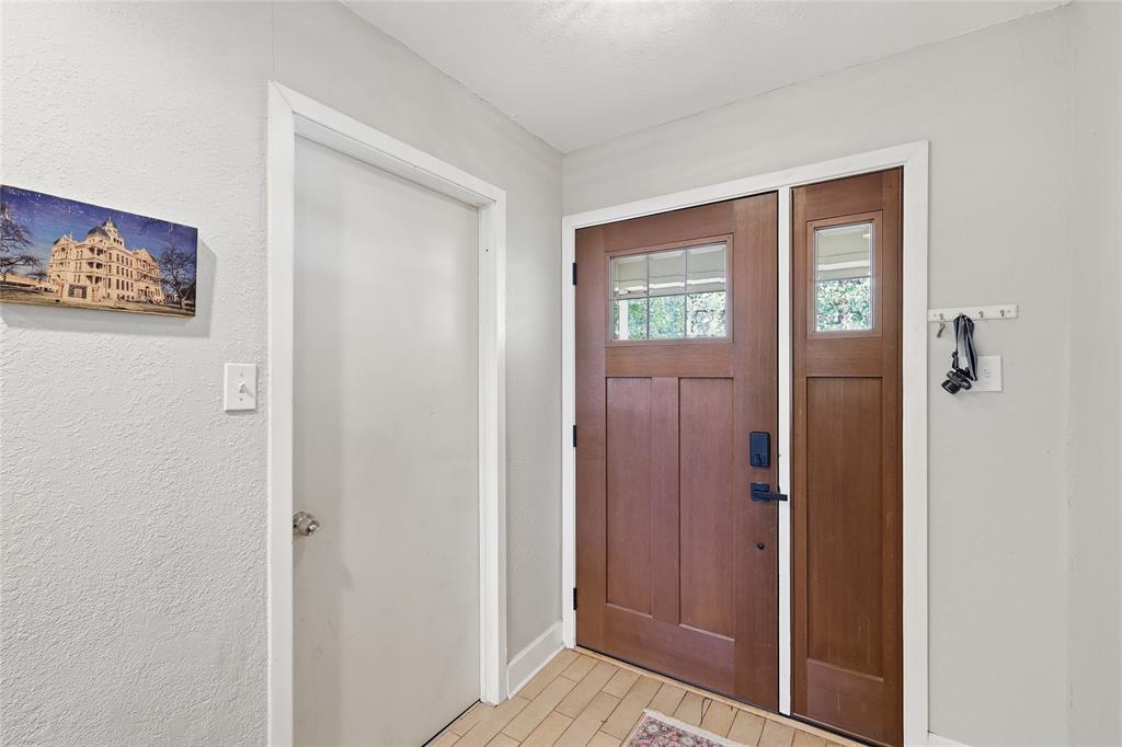 16 Coffee Tavern Road Bedford, TX 76022 - Photo 3 of 24 Craftsman-style front entry door with a sidelight and upper window panes