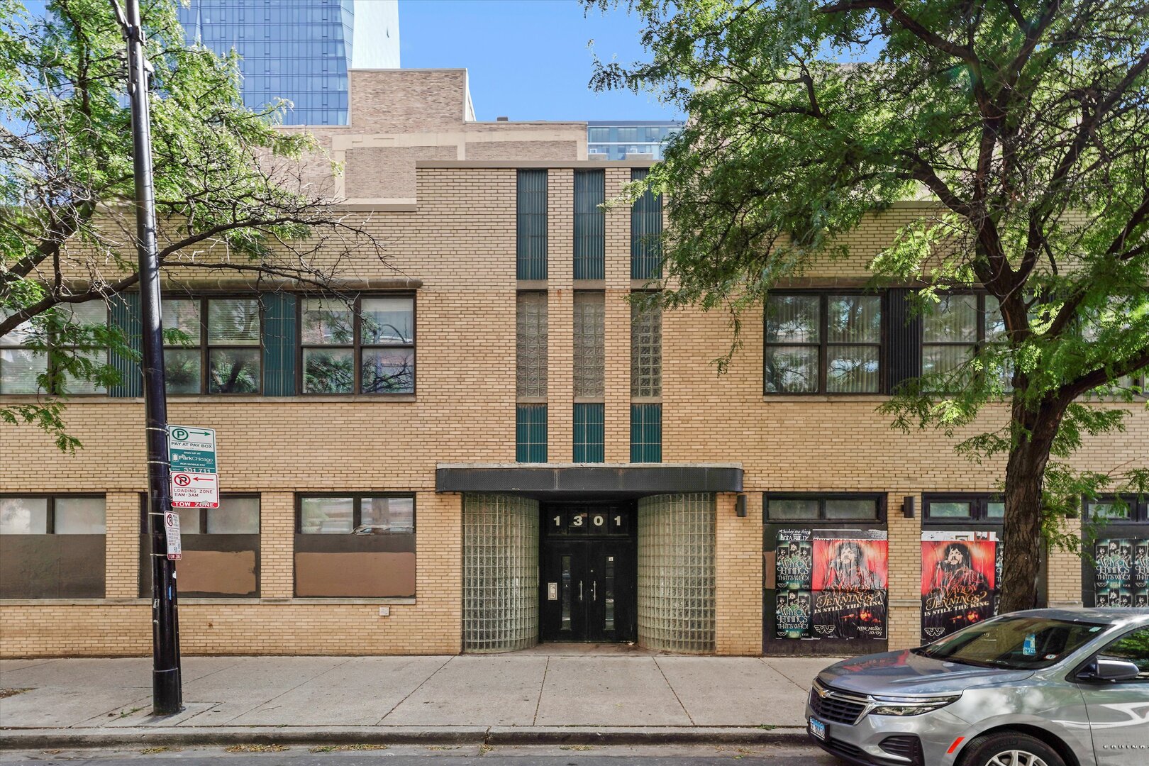1301 South Wabash Avenue, Unit 1 Chicago, IL 60605 - Photo 1 of 29 a car parked in front of a brick house