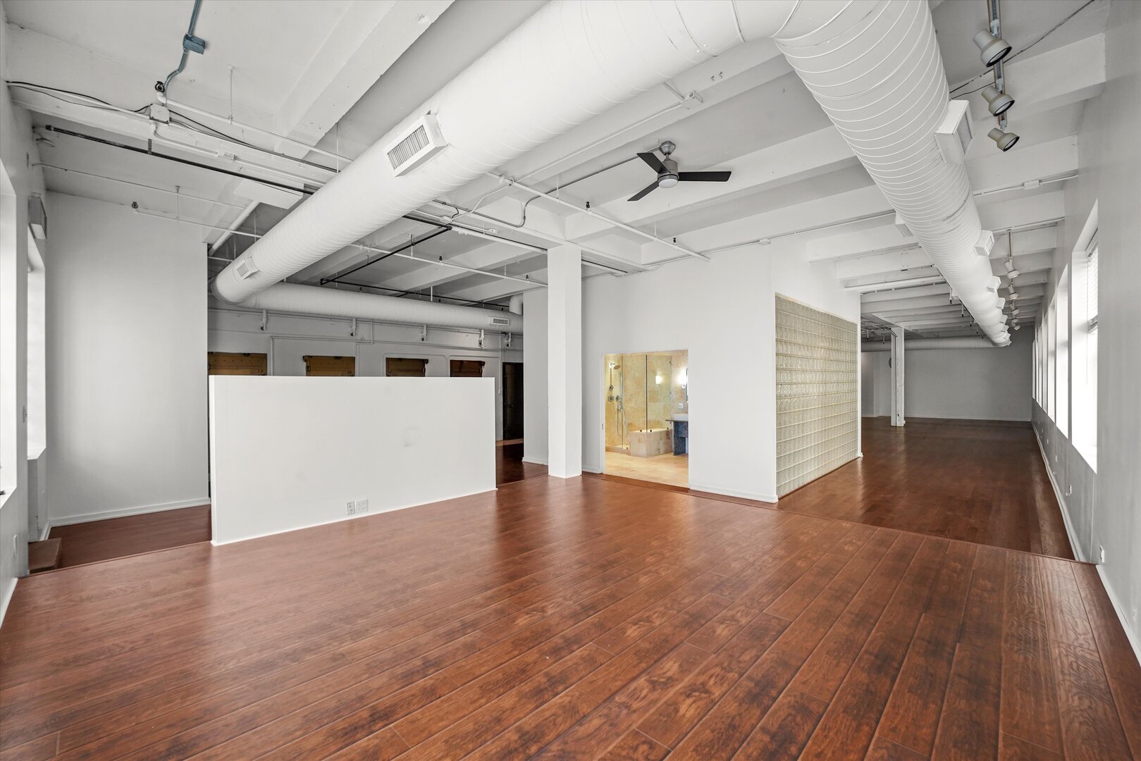 1301 South Wabash Avenue, Unit 1 Chicago, IL 60605 - Photo 18 of 29 a view of a hallway with wooden floor