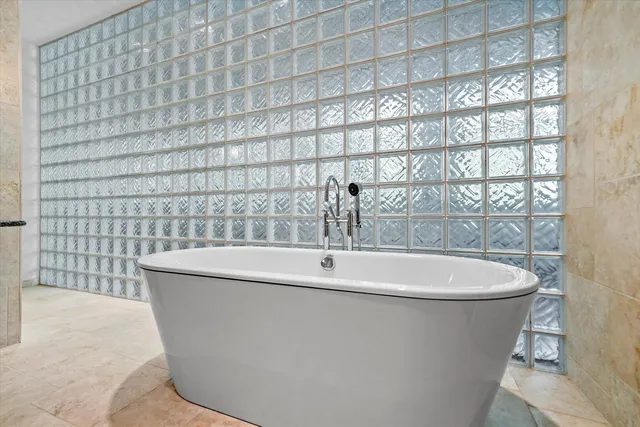 a white bath tub sitting in a bathroom