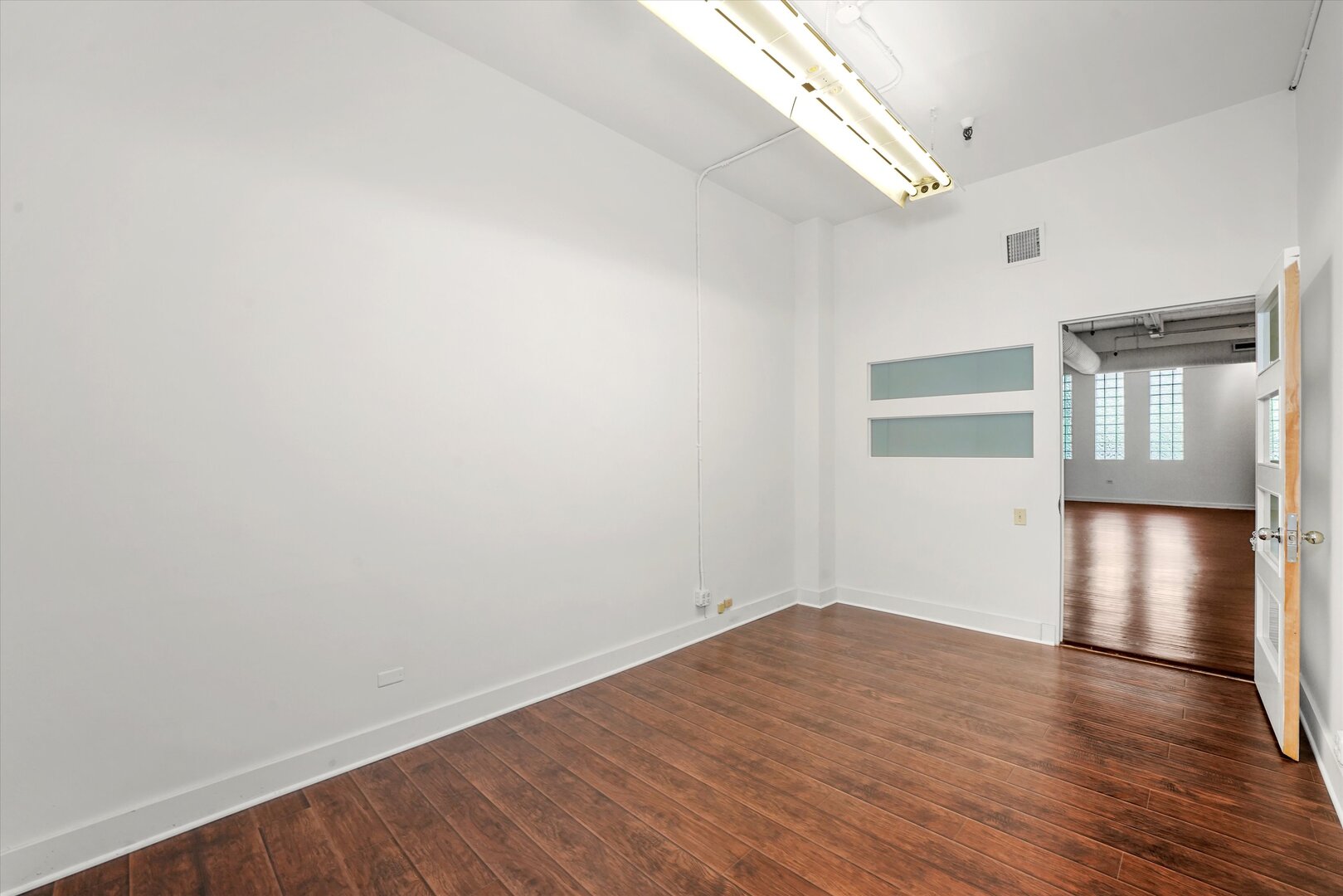 1301 South Wabash Avenue, Unit 1 Chicago, IL 60605 - Photo 26 of 29 a view of empty room with wooden floor