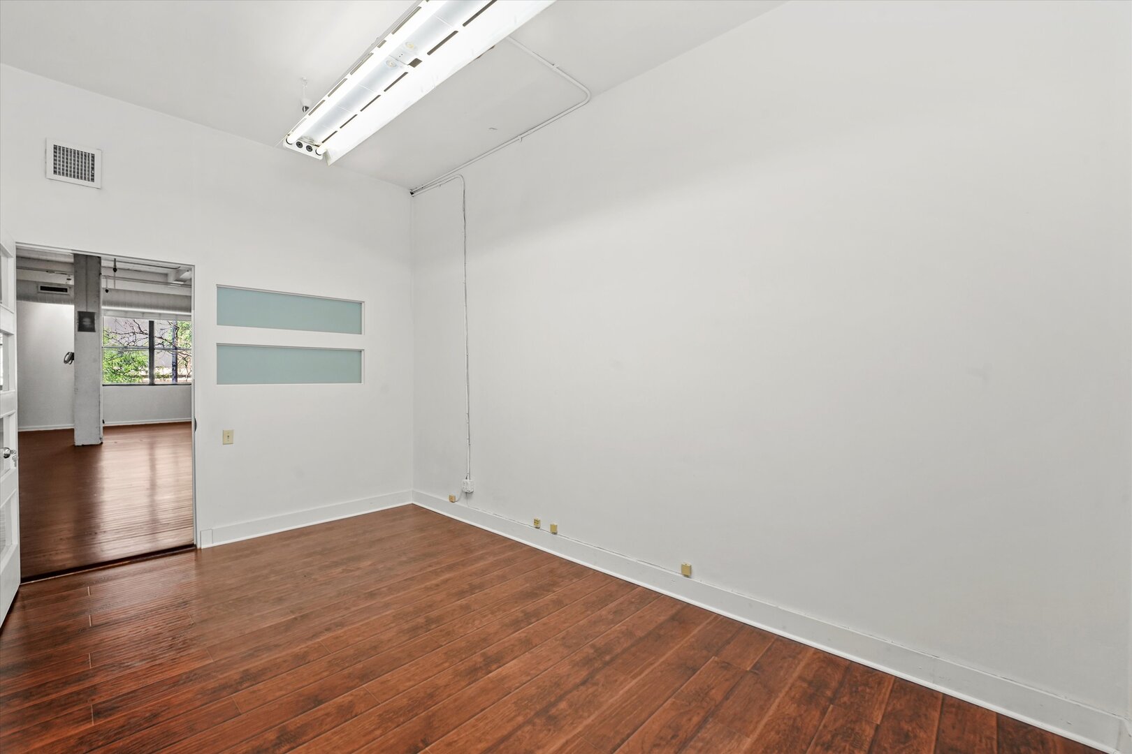 1301 South Wabash Avenue, Unit 1 Chicago, IL 60605 - Photo 27 of 29 wooden floor in an empty room