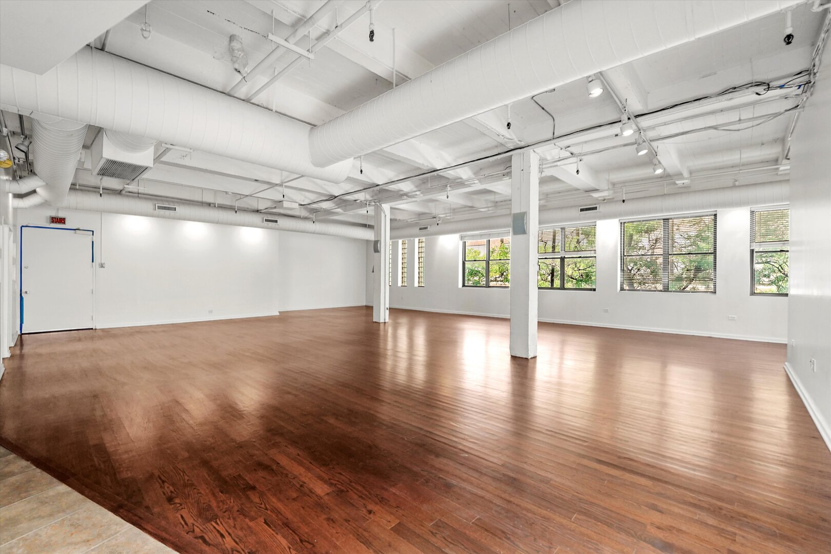1301 South Wabash Avenue, Unit 1 Chicago, IL 60605 - Photo 10 of 29 a view of a room with wooden floors