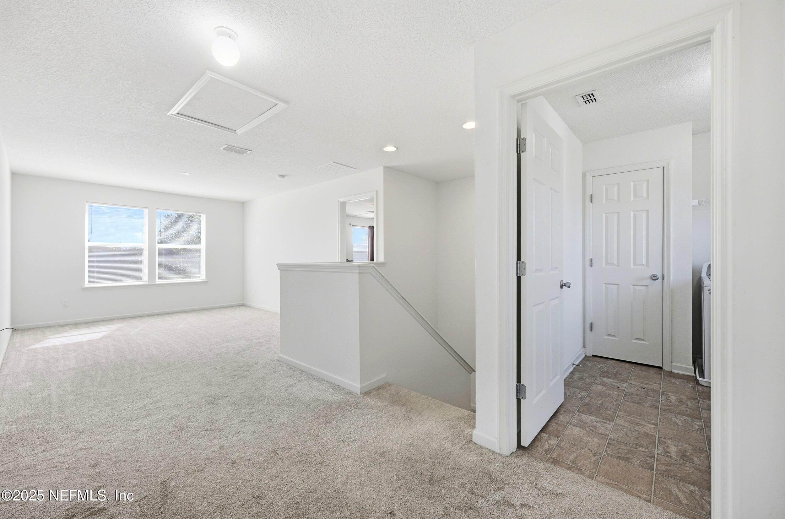 7478 Steventon Way Jacksonville, FL 32244 - Photo 13 of 26 a view of a big room with windows and closet
