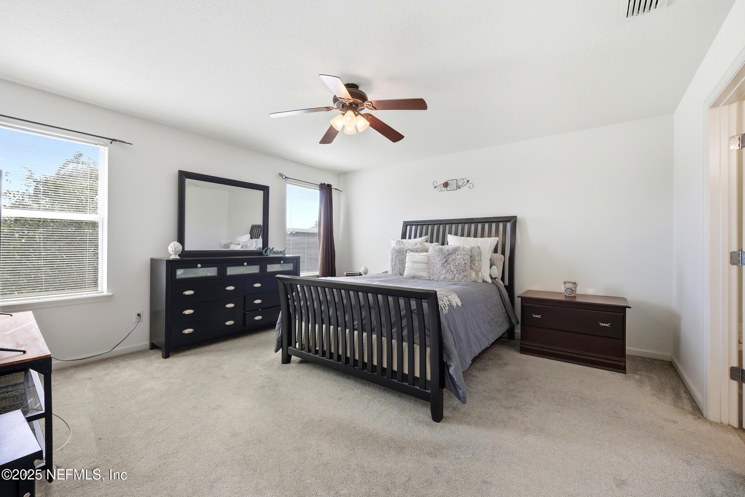 7478 Steventon Way Jacksonville, FL 32244 - Photo 15 of 26 a bedroom with a bed and window