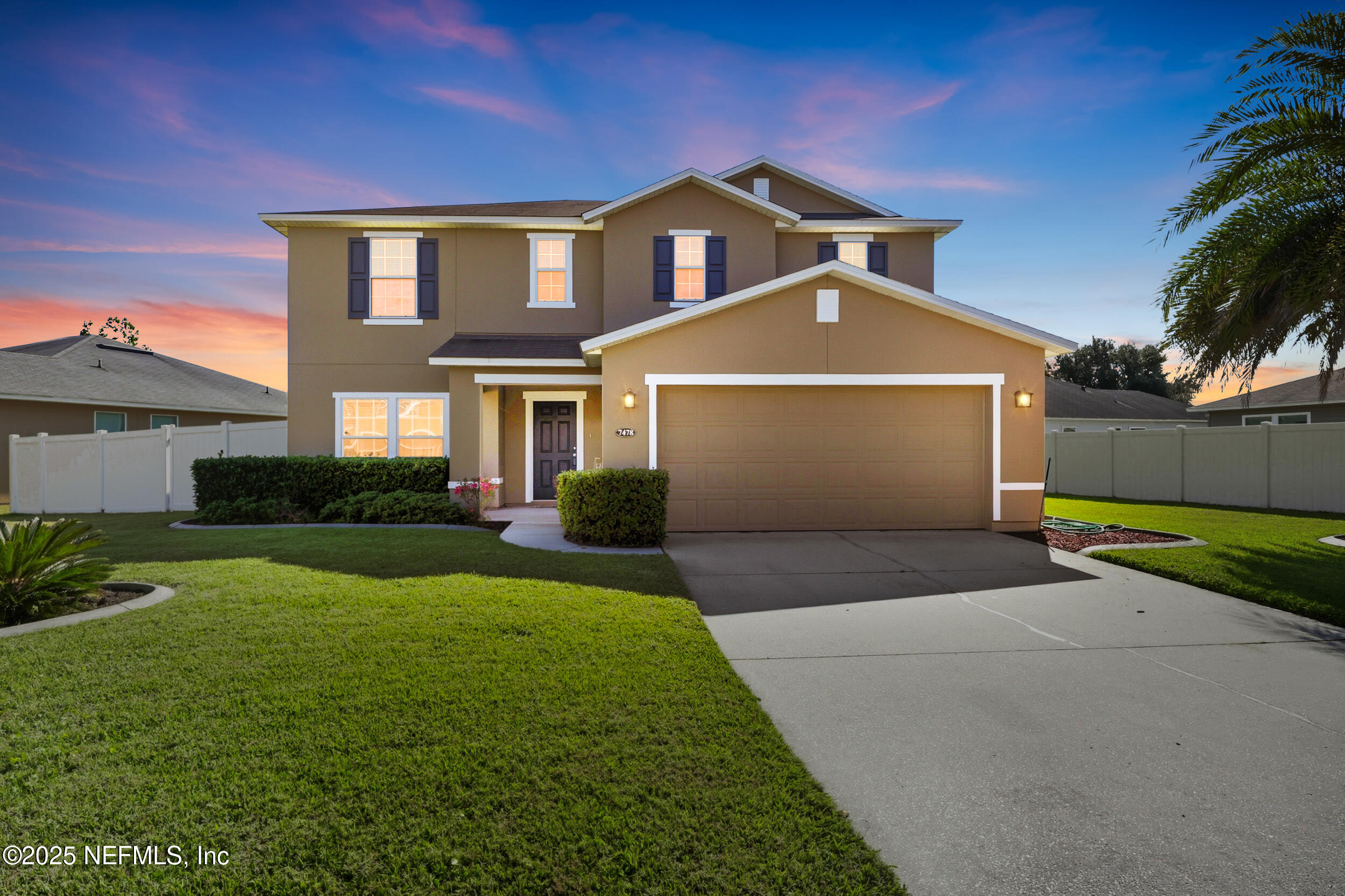 7478 Steventon Way Jacksonville, FL 32244 - Photo 23 of 26 a front view of a house with a yard and garage