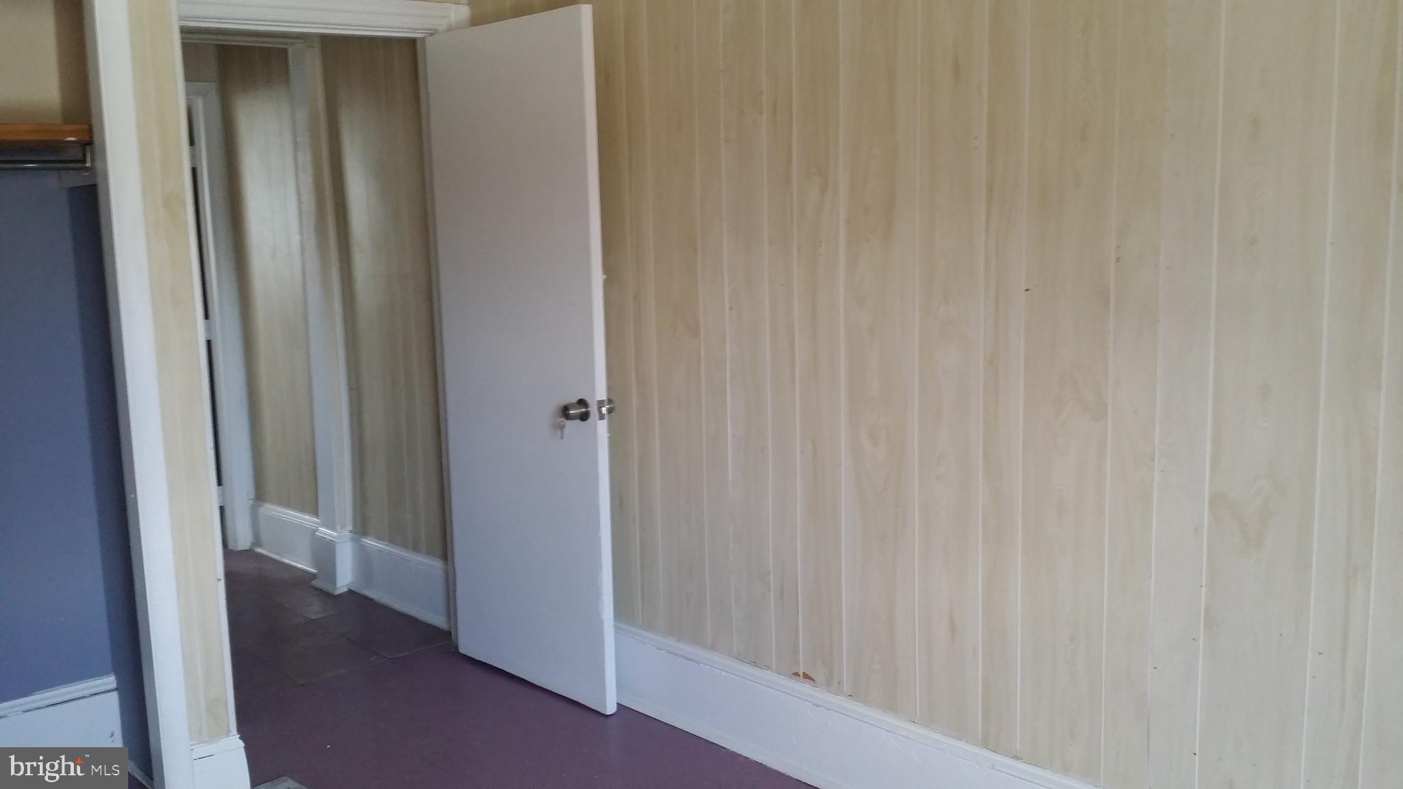 1983 North 63rd Street Philadelphia, PA 19151 - Photo 2 of 3 a view of a hallway with wooden floor