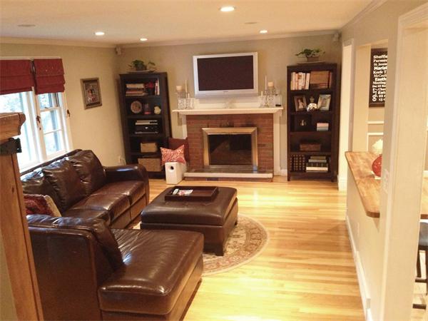 21 Eaton Road Framingham, MA 01701 - Photo 6 of 13 a living room with furniture and a fireplace