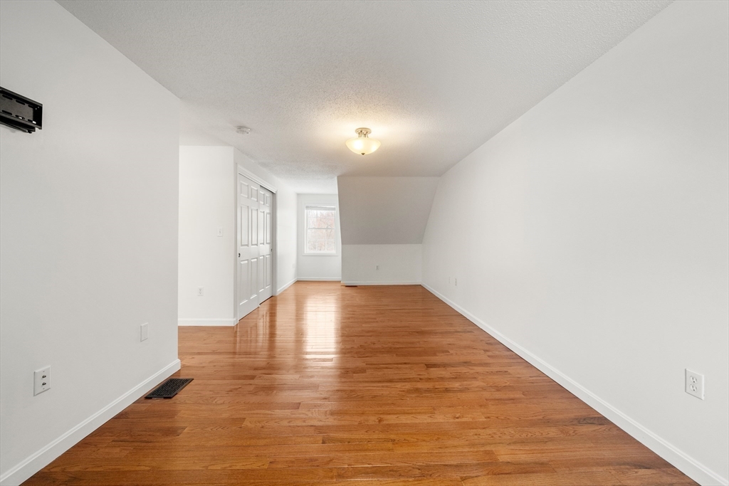 181 High Street, Unit 1 Andover, MA 01810 - Photo 12 of 21 a view of empty room with wooden floor