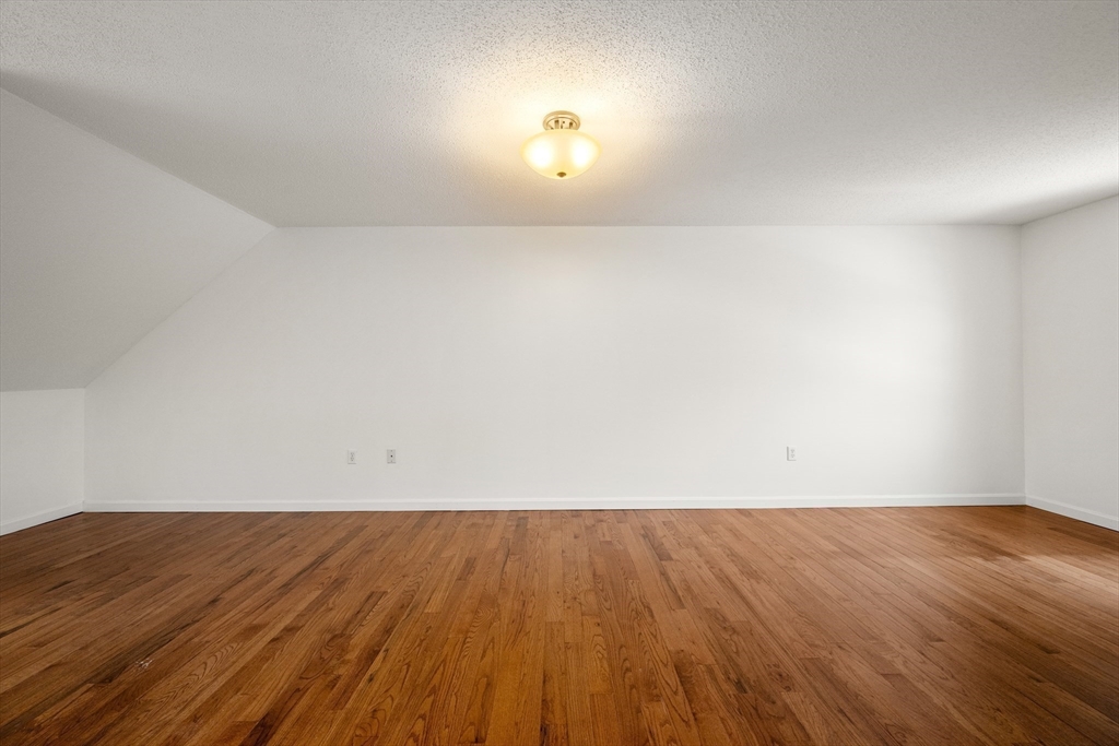 181 High Street, Unit 1 Andover, MA 01810 - Photo 14 of 21 a view of a room with wooden floor