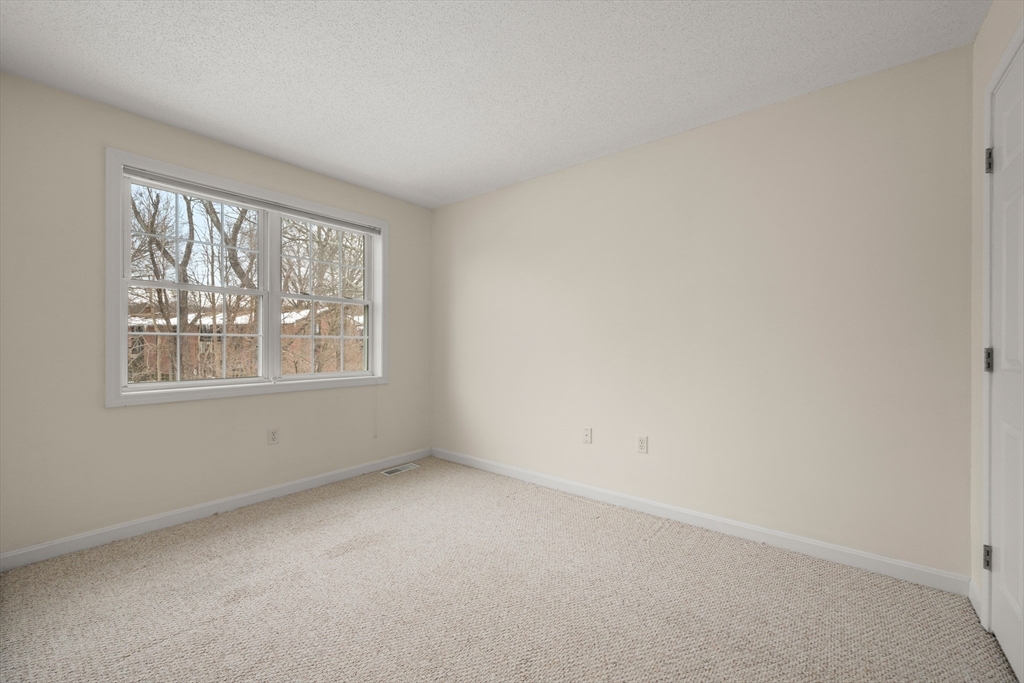 181 High Street, Unit 1 Andover, MA 01810 - Photo 17 of 21 an empty room with windows