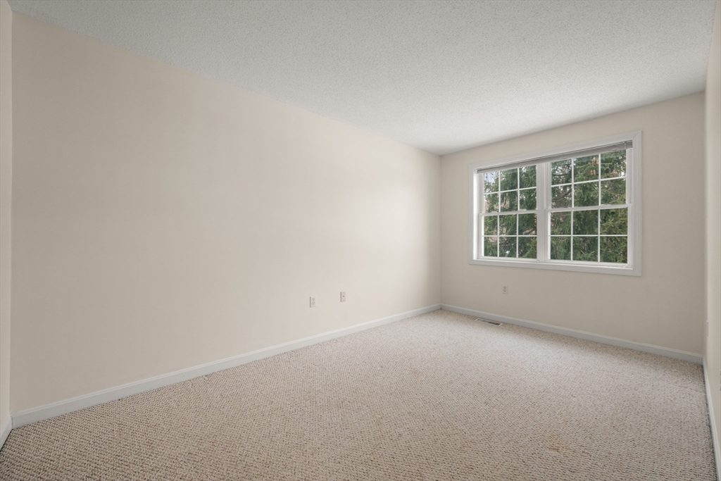 181 High Street, Unit 1 Andover, MA 01810 - Photo 18 of 21 an empty room with windows