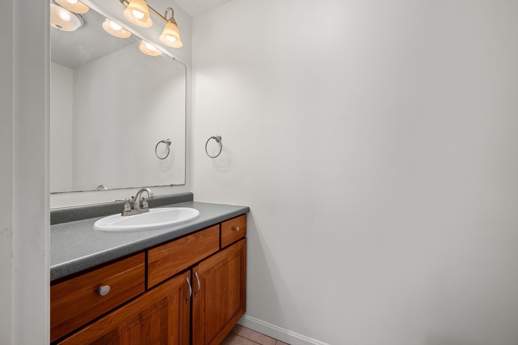 181 High Street, Unit 1 Andover, MA 01810 - Photo 9 of 21 a bathroom with a sink and a mirror