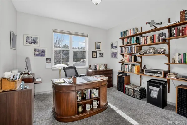 a bedroom with a bed and a table