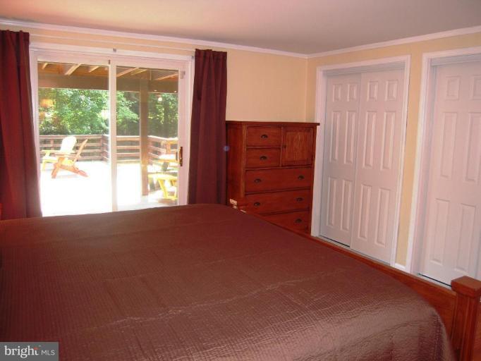 6707 Queens Ferry Road Baltimore, MD 21239 - Photo 11 of 23 a view of an empty room with a window
