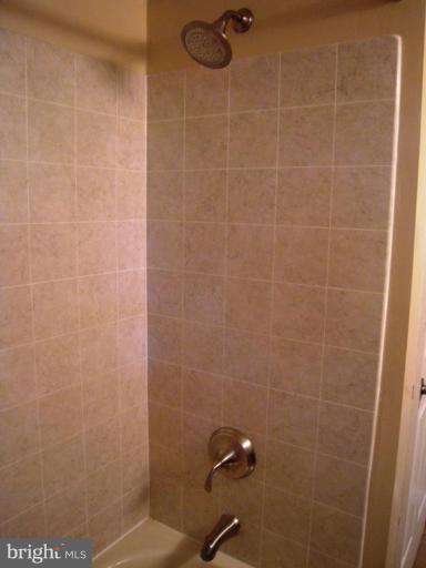 6707 Queens Ferry Road Baltimore, MD 21239 - Photo 14 of 23 a bathroom with a shower