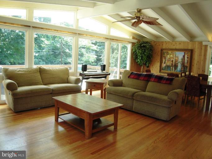 6707 Queens Ferry Road Baltimore, MD 21239 - Photo 16 of 23 a living room with furniture and a large window
