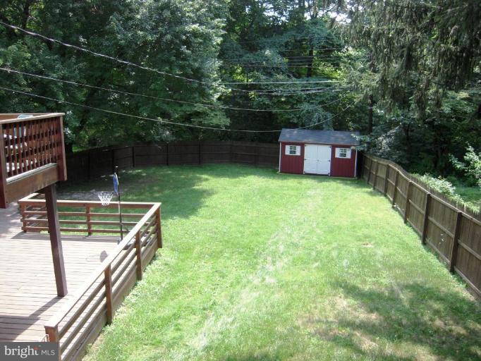 6707 Queens Ferry Road Baltimore, MD 21239 - Photo 23 of 23 a view of a backyard with sitting area