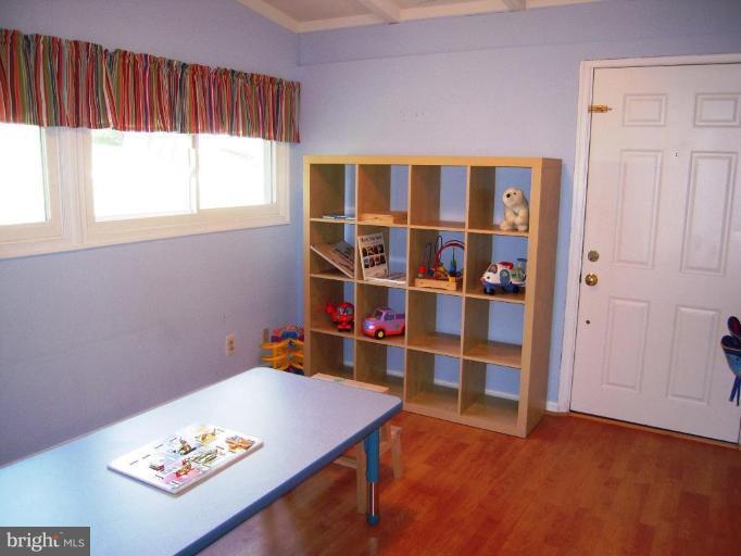 6707 Queens Ferry Road Baltimore, MD 21239 - Photo 8 of 23 a view of a room with shelves