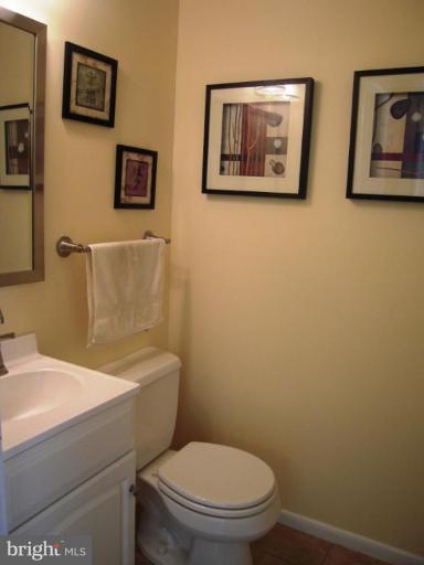 6707 Queens Ferry Road Baltimore, MD 21239 - Photo 9 of 23 a white toilet sitting next to a white sink