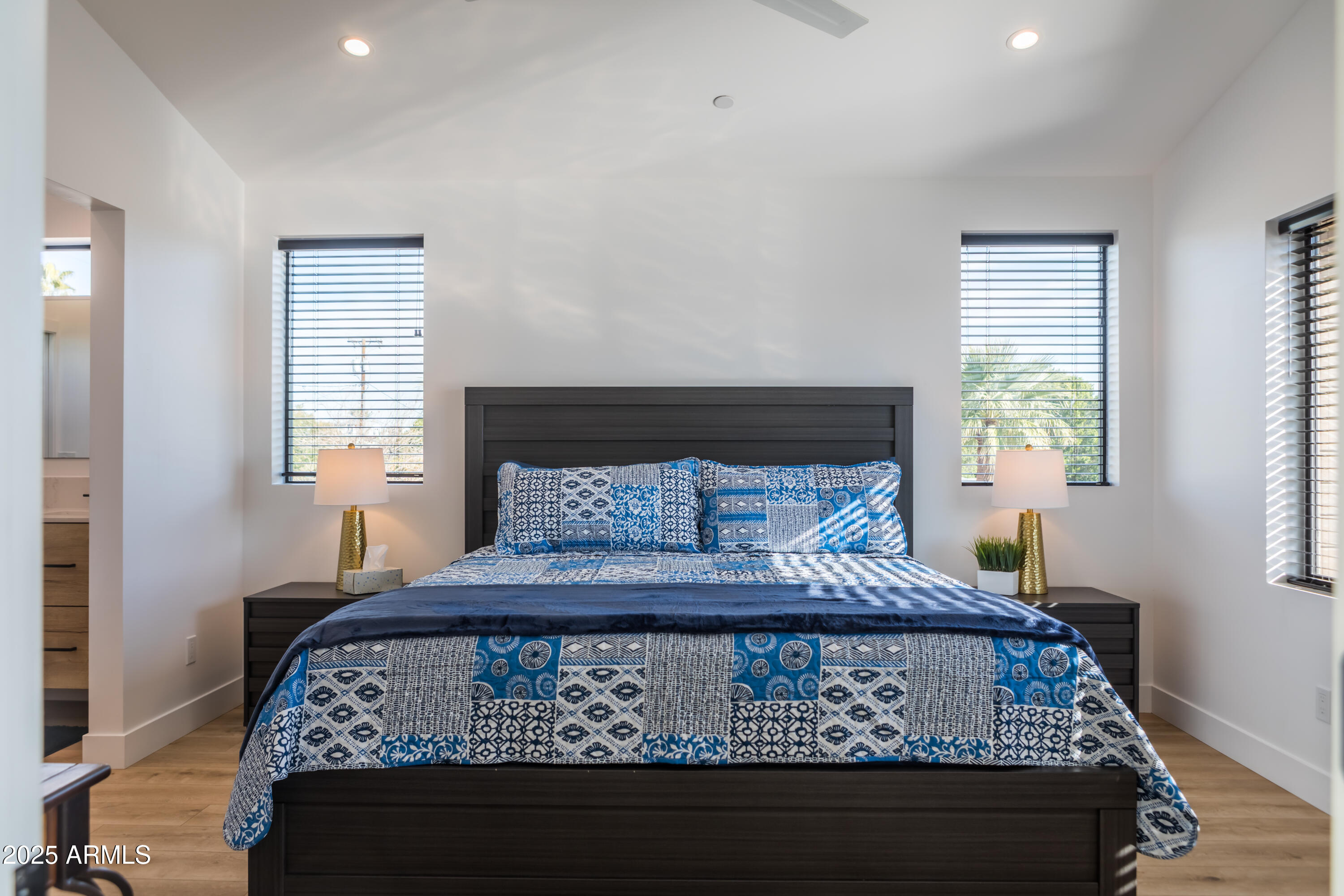 302 West Culver Street, Unit 3 Phoenix, AZ 85003 - Photo 13 of 21 a bedroom with a bed window and a table