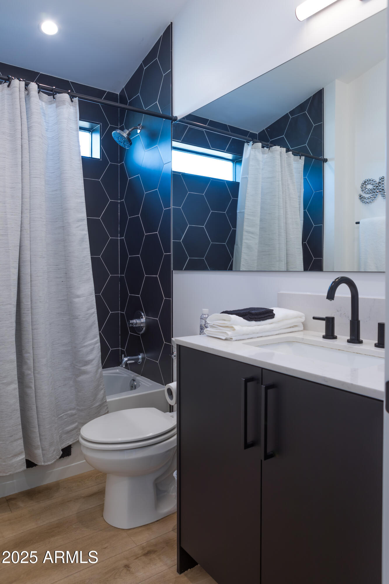 302 West Culver Street, Unit 3 Phoenix, AZ 85003 - Photo 17 of 21 a bathroom with a sink toilet and shower