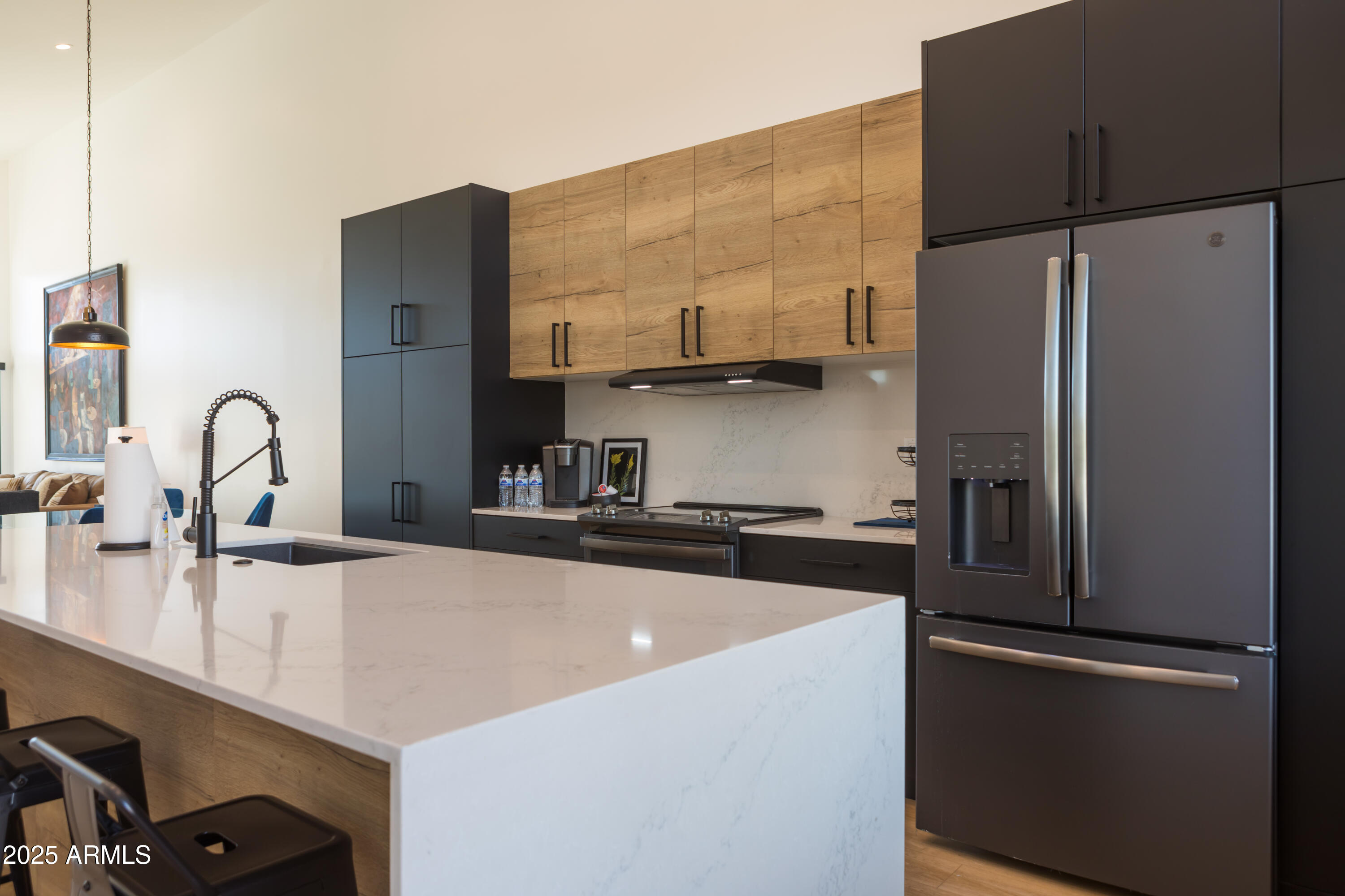 302 West Culver Street, Unit 3 Phoenix, AZ 85003 - Photo 4 of 21 a kitchen with stainless steel appliances a refrigerator sink and white cabinets