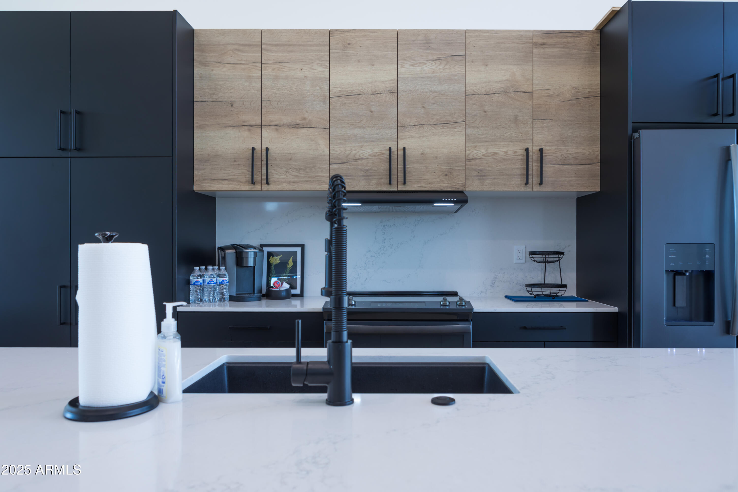 302 West Culver Street, Unit 3 Phoenix, AZ 85003 - Photo 5 of 21 a kitchen with a refrigerator and cabinets