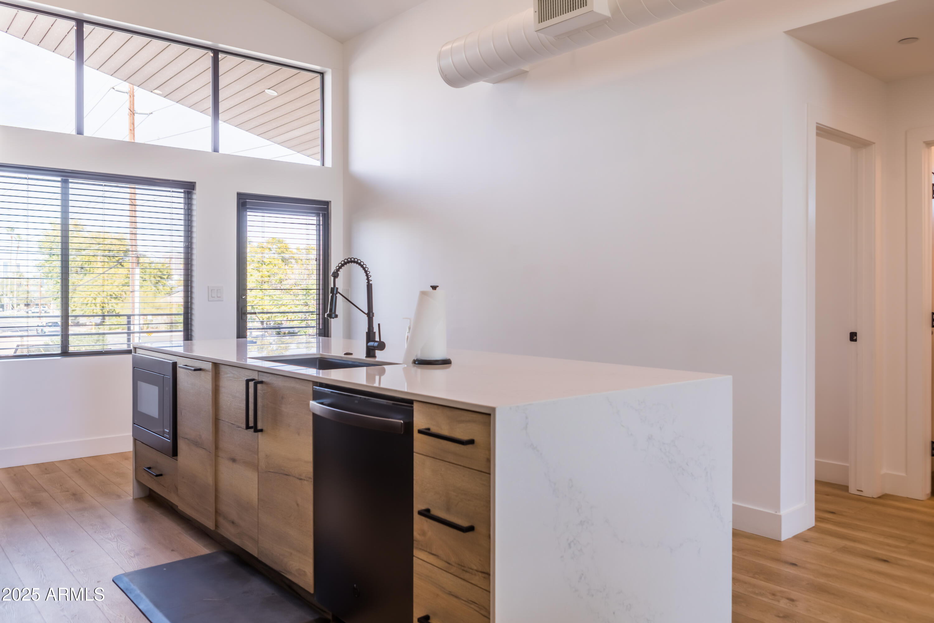 302 West Culver Street, Unit 3 Phoenix, AZ 85003 - Photo 6 of 21 a kitchen with a sink cabinets and wooden floor