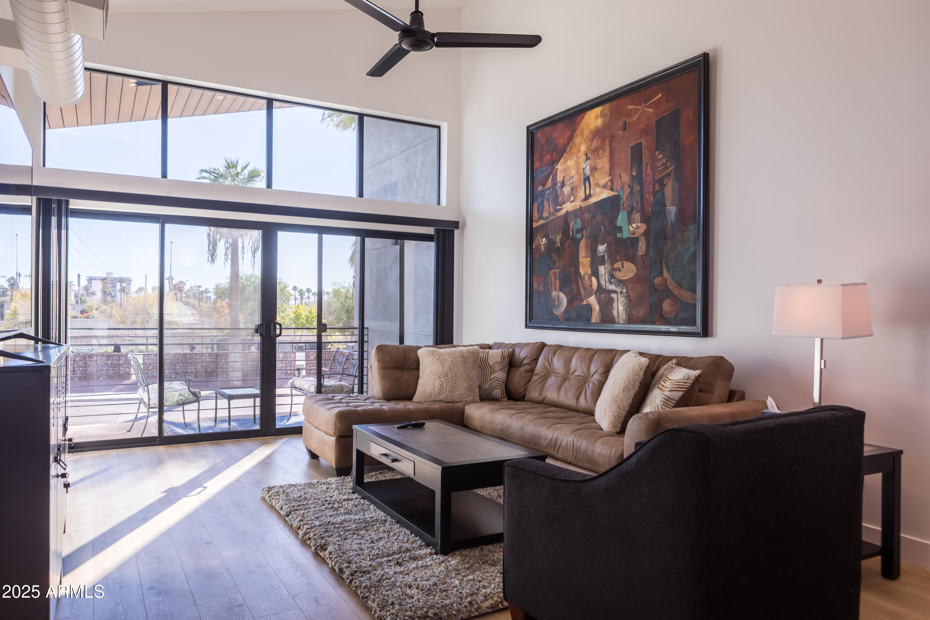 302 West Culver Street, Unit 3 Phoenix, AZ 85003 - Photo 10 of 21 a living room with furniture and a window