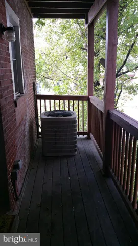 a view of balcony with wooden floor