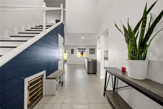 a lobby with furniture and a potted plant