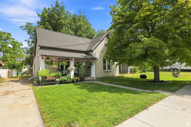 154 West 400 North Springville, UT 84663 - Photo 7 of 43 Brick exterior with a covered front porch and gabled roofline