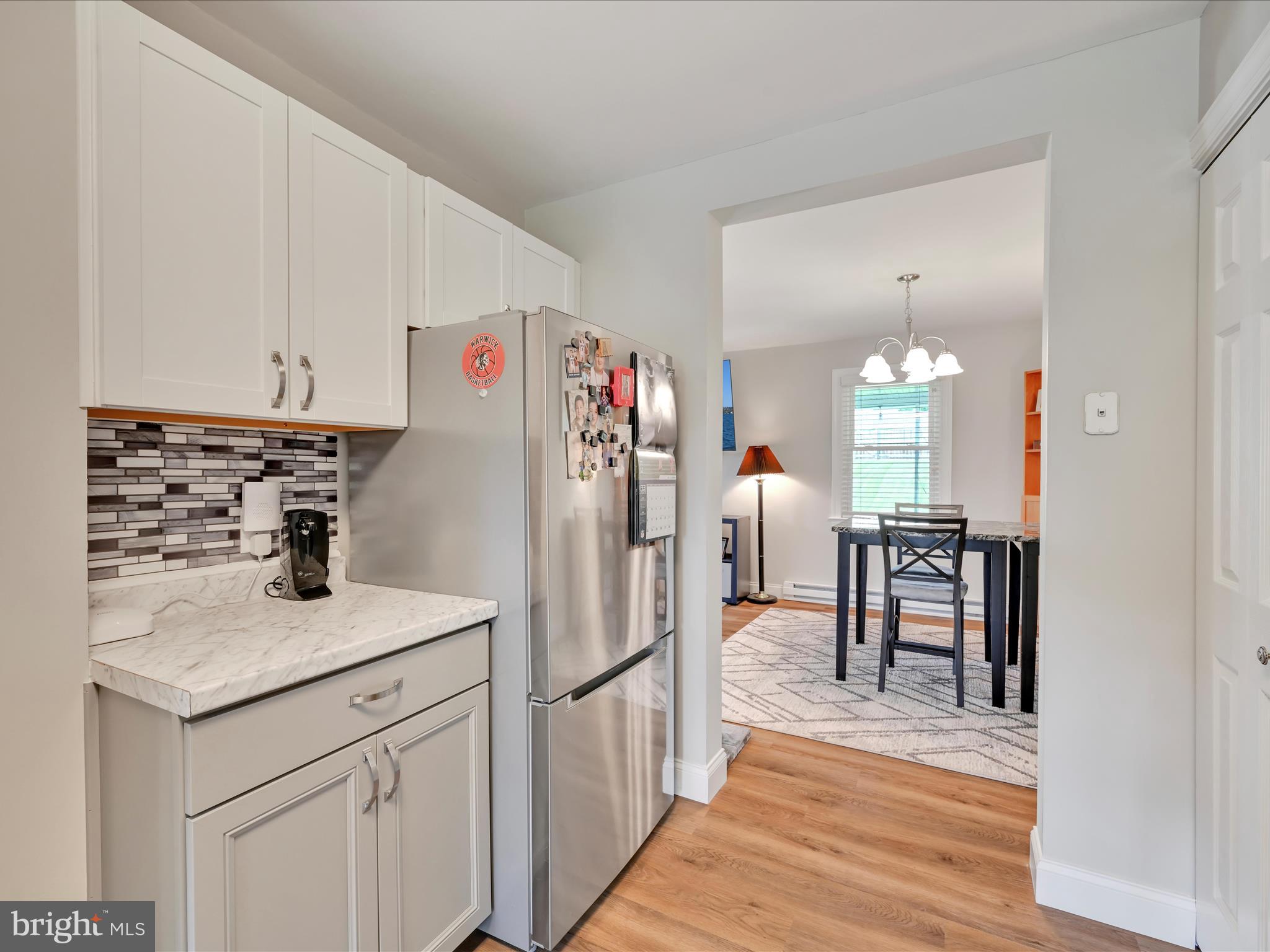461 Crosswinds Drive Lititz, PA 17543 - Photo 11 of 32 a kitchen with refrigerator and chairs