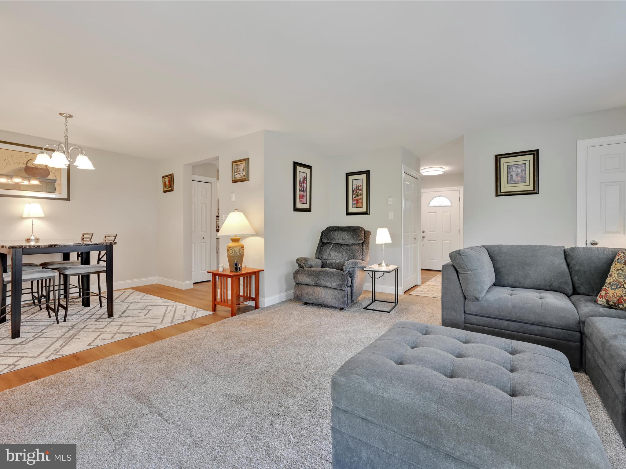 461 Crosswinds Drive Lititz, PA 17543 - Photo 14 of 32 a living room with furniture and a dining table with kitchen view