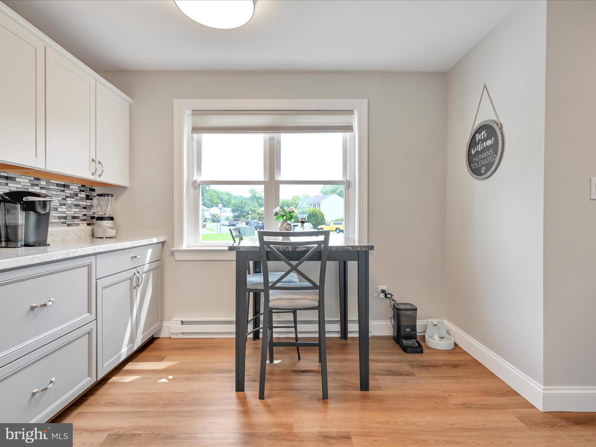 461 Crosswinds Drive Lititz, PA 17543 - Photo 8 of 32 a dining room with wooden floor and a table