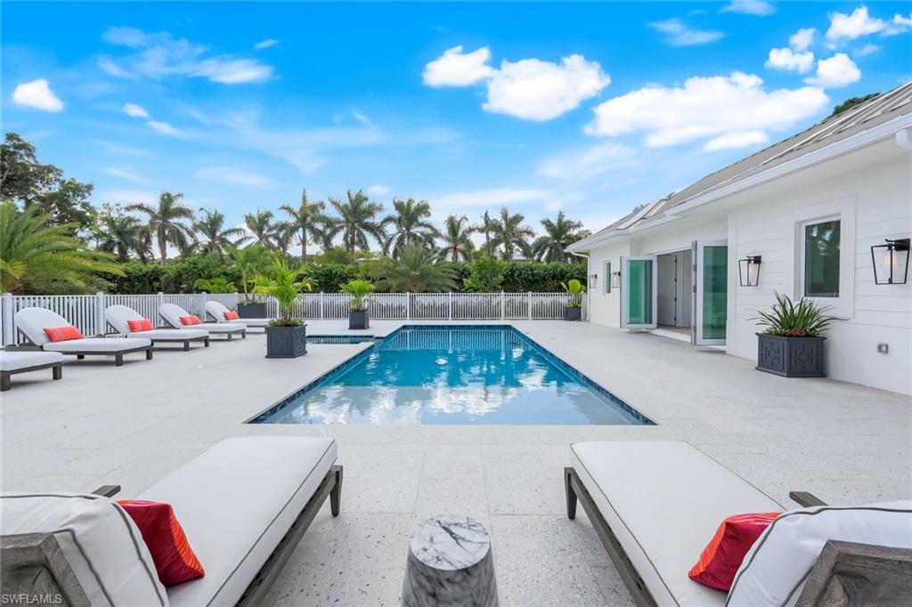 3136 Ravenna Avenue Naples, FL 34120 - Photo 11 of 50 a view of a terrace with furniture and a potted plant