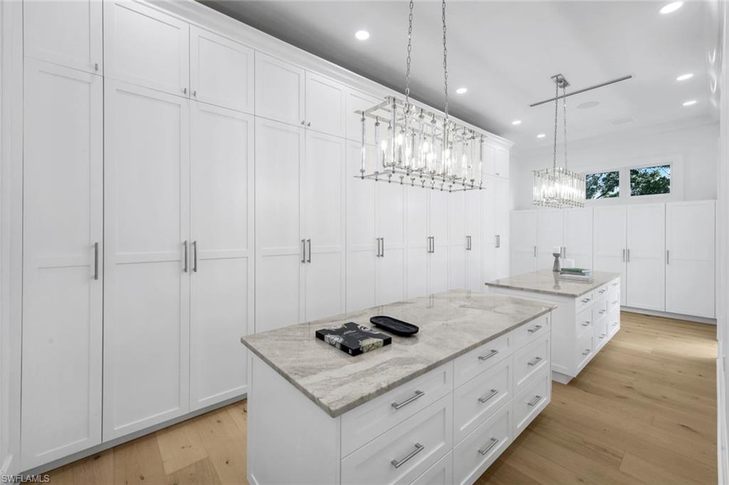 3136 Ravenna Avenue Naples, FL 34120 - Photo 29 of 50 a kitchen with a stove and cabinets