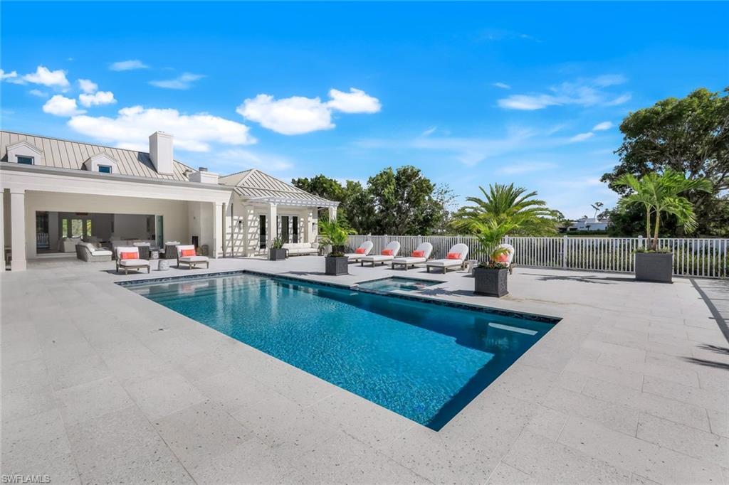 3136 Ravenna Avenue Naples, FL 34120 - Photo 3 of 50 a view of a swimming pool with outdoor seating